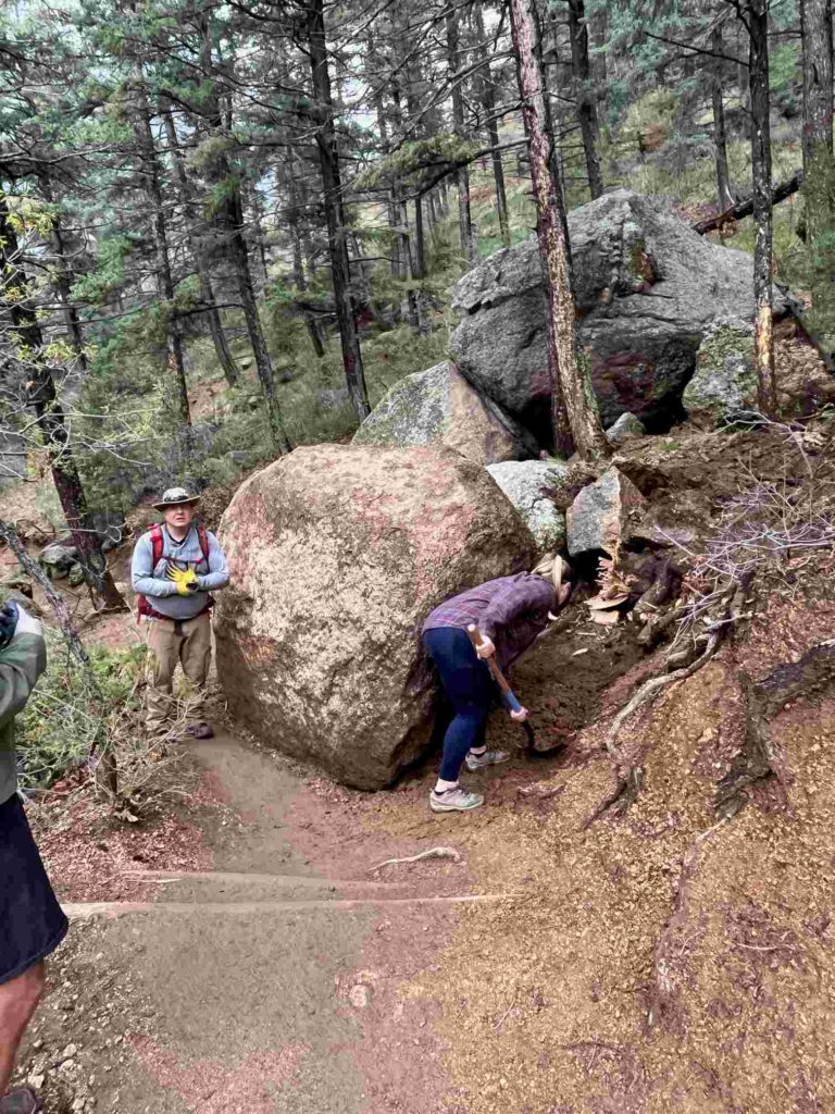 Brian next to boulder